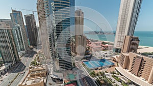 Panoramic view of the Dubai Marina and JBR area and the famous Ferris Wheel aerial timelapse