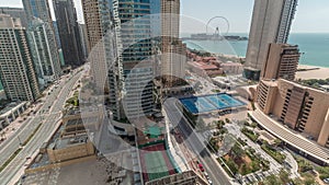 Panoramic view of the Dubai Marina and JBR area and the famous Ferris Wheel aerial timelapse