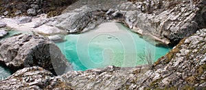 Panoramic view on emerald green turquoise limestone bay in great canyon of soca river, slovenia