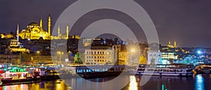 Panoramic view of Eminonu at night with Suleymaniye Mosque, Istanbul, Turkey photo