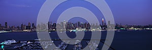 Panoramic view of Empire State Building and Manhattan, NY skyline with Hudson River and harbor, shot from Weehawken, NJ