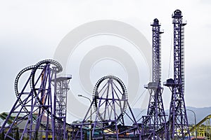 Panoramic view of an empty rollercoaster ride with sharp turns and twists