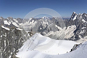 A panoramic view of European Alps on a sunny day. Mount Blanc as a highest mountain in Europe covered with snow and glacier.