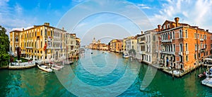 Panoramic view of famous Canal Grande and Basilica di Santa Maria della Salute at sunset in Venice, Italy