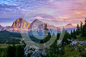 Panoramic view of famous Dolomites mountain peaks glowing in beautiful golden evening light at sunset in summer, South Tyrol,