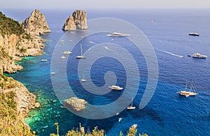 Panoramic view of famous Faraglioni Rocks, most visited travel attraction of Capri Island, Italy.