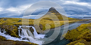 Panoramic view of famous Kirkjufell mountain with Kirkjufellsfoss water falls in Iceland photo
