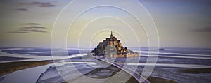 Panoramic view of famous Le Mont Saint-Michel tidal island with sunset sky scene