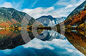 Panoramic view of the famous mountain village Hallstatt, Austria. Lake with reflections.