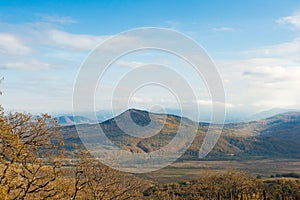 Panoramic view on faraway mountains in fall season