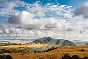 Panoramic view of farm fields, villages and hills, summer scenery