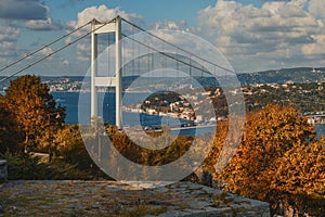 Panoramic view with Fatih Sultan Mehmet bridge over Bosphorus in autumn at Istanbul