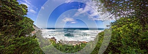 Panoramic view from a forest onto the coast of the Indian Ocean in South Africa\'s Tsitsikama National Park