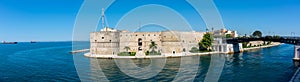 Panoramic View of the Fountain in the middle of Ebalia Square in the Center of Taranto, in the South of Italy in a Sunny Day of photo
