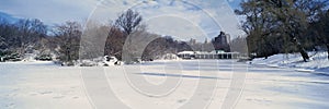 Panoramic view of frozen pond in Central Park, Manhattan, New York City, NY after winter snowstorm photo