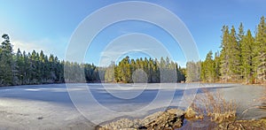 Panoramic view of frozen Spectacke Lake in Vancouver Island, Canada