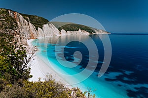 Panoramic view of Fteri beach, blue lagoon with rocky coastline, Kefalonia, Greece. Calm clear blue emerald green photo