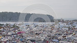 Panoramic view of garbage dump in winter in winter forest, Russia