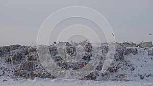 Panoramic view of garbage dump in winter in winter forest, Russia