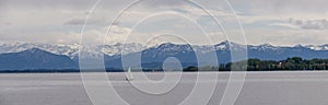 Panoramic view of German lake `Starnberger See` with beautiful alp mountains