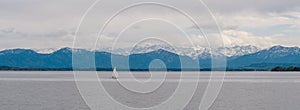 Panoramic view of German lake `Starnberger See` with beautiful alp mountains