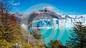 Panoramic view of the gigantic Perito Moreno glacier, its tongue and lagoon in Patagonia in golden Autumn, Argentina