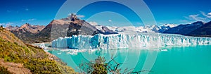 Panoramic view of the gigantic Perito Moreno glacier, its tongue and lagoon in Patagonia in golden Autumn, Argentina