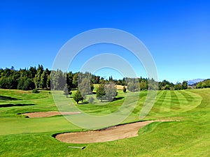 Panoramic view of golf course in Argentine Patagonia under blue sky. Nature and outdoor sports