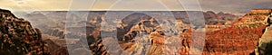 Panoramic view of the Grand Canyon from the south rim trail viewpoint with the sunset creating beautiful color shades
