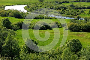 Panoramic view of the grassy meadows and wetlands - wildlife and birds reserve - and the Biebrza river in the Biebrzanski National