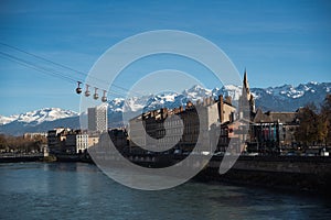 Panoramic view of The Grenoble-Bastille cable car, the Isere river and the Belledonne mountain range in the background