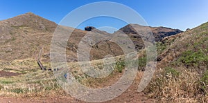 Panoramic view of a group of tourists hiking in St. Lourenço Cape or Cabo de São Lourenço, on Madeira Island, Portugal