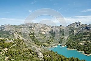 Panoramic view of Guadalest reservoir and Sierra de Serrella mountains. Guadalest is one of most beautiful village of