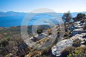 Panoramic view of the gulf of Mirambello with Spinalonga island. View from the mountain of Oxa with ruins of ancient water tanks.