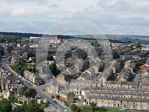 Panoramic view of Halifax in west yorkshire with rows of terraced streets buildings roads and surrounding countryside
