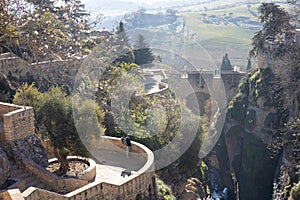 Panoramic view of hanging gardens of Cuenca over El Tajo Gorge with whitewashed houses of Ronda, Andalusia, Spain.