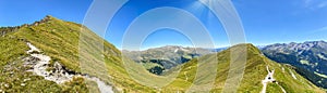 Panoramic view of a hiking trail through the Austrian Alps in the high mountains of the Zillertal near the Tux Glacier in summer,