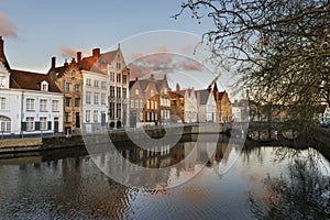 Panoramic view of the historic city center of Brugge in beautiful golden morning light at sunrise