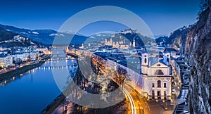 Panoramic view of historic city of Salzburg with Festung Hohensalzburg and river Salzach during blue hour, Salzburger Land,