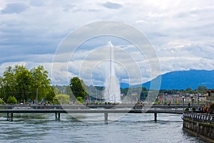 Panoramic view of historic Geneva Jet d'Eau fountain at harbor district