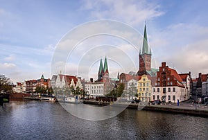 Panoramic view of historic skyline of hanseatic town of Lübeck with famous St. Mary`s Church on a beautiful sunny day with