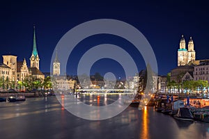 Panoramic view of historic Zurich city center with famous Fraumunster Church and river Limmat at Lake Zurich , in twilight, Canto