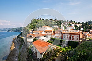 Panoramic view of houses and old city walls of Piran