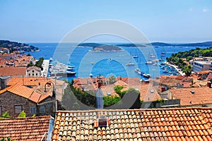 Panoramic view of Hvar town harbor with red roofs in Croatia