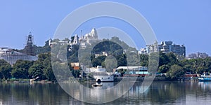 Hyderabad cityscape in India, Marble stone Birla temple and reflection in Hussain Sagar lake photo