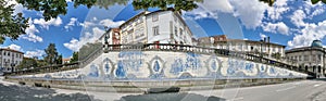 Panoramic view at iconic decorative tiles panel, artistic element representative at the antique regional costumes, located on photo