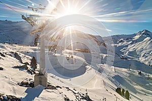 Panoramic view Idalp skiing area with many ski slope, pistes, ski chairlifts gondola against mountain landscape and