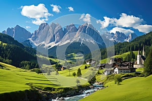 Panoramic view of idyllic mountain scenery in the Alps with fresh green meadows in bloom on a beautiful sunny day in springtime