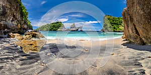 Panoramic view of idyllic tropical beach with small island and perfect azure clean water