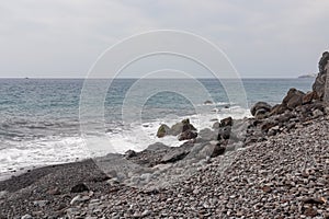 Garajau - Panoramic view of idyllic volcanic black stone beach of Praia Garajai, Canico, Madeira island, Portugal, Europe
